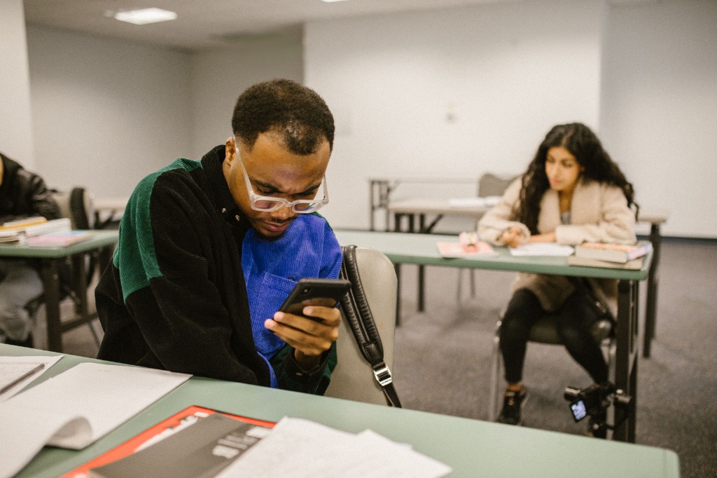Two students revising in a classroom
